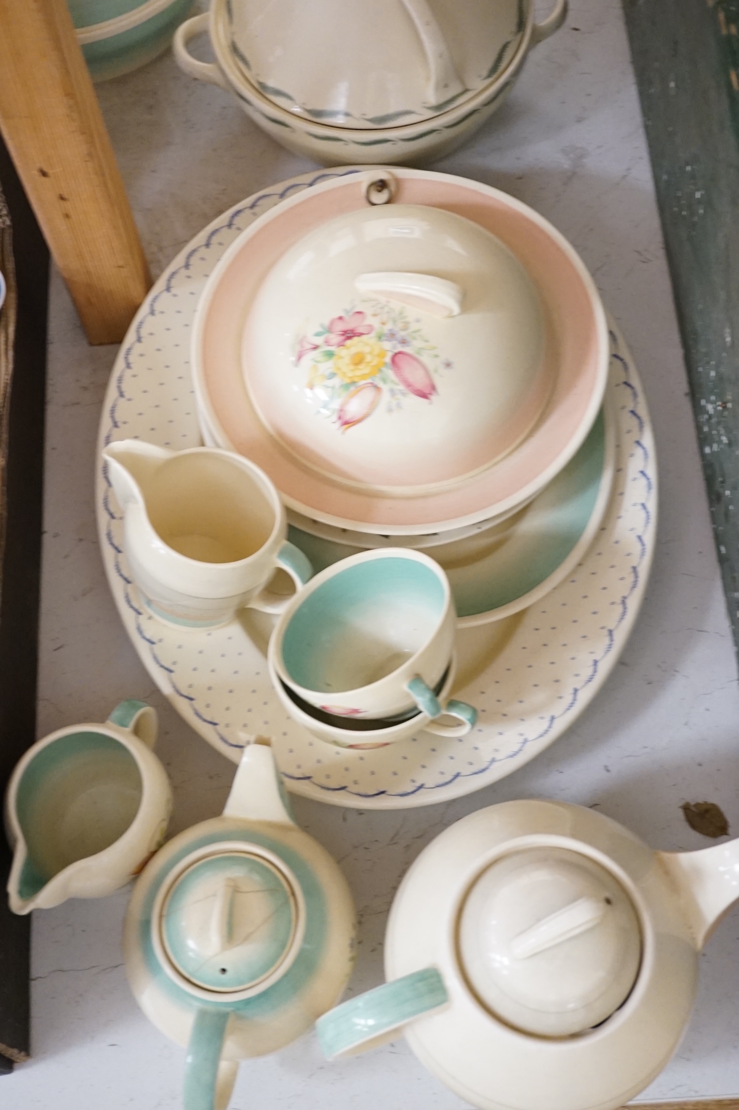 A collection of Susie Cooper ceramics and tablewares including tureens, an oval platter, cups and saucers